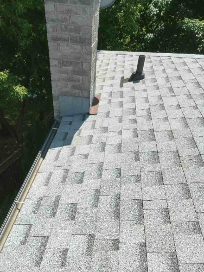 JamrockRoofing chimney flashing and shingle detail work